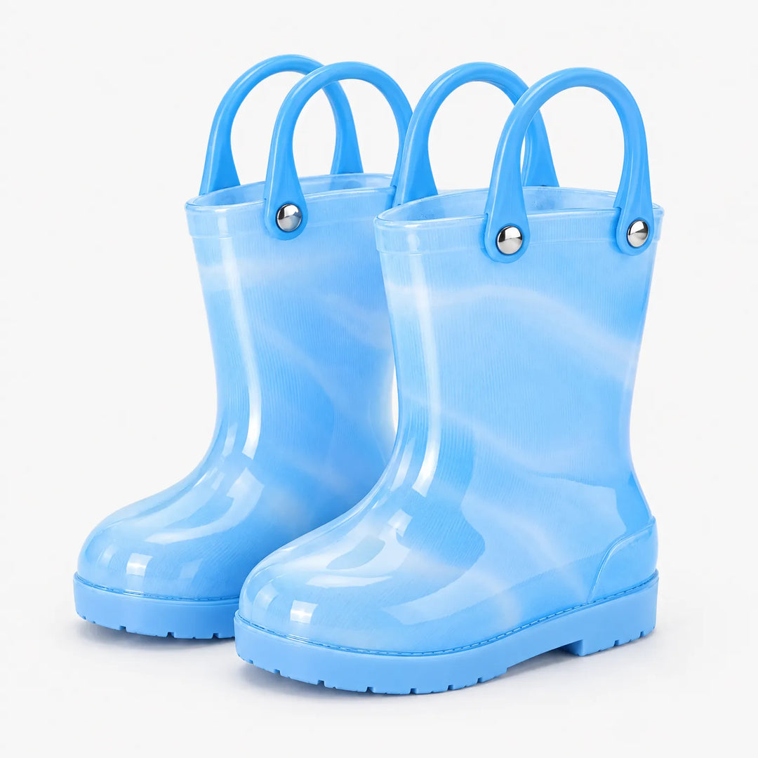 Pair of translucent blue rain boots with blue carry handles and silver rivets, shown from a three-quarter front angle. 11