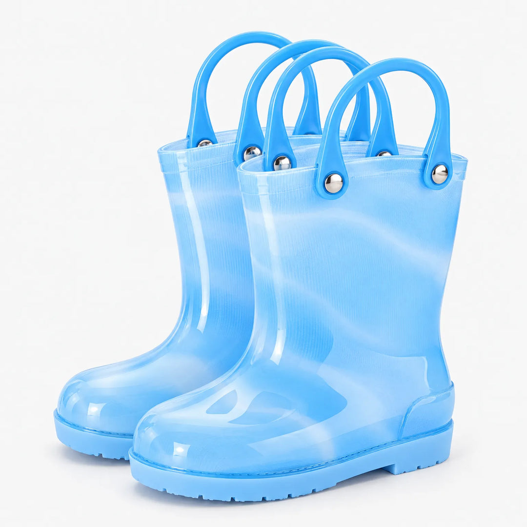 Pair of translucent light blue rain boots with blue carry handles attached by silver rivets on a white background. 5