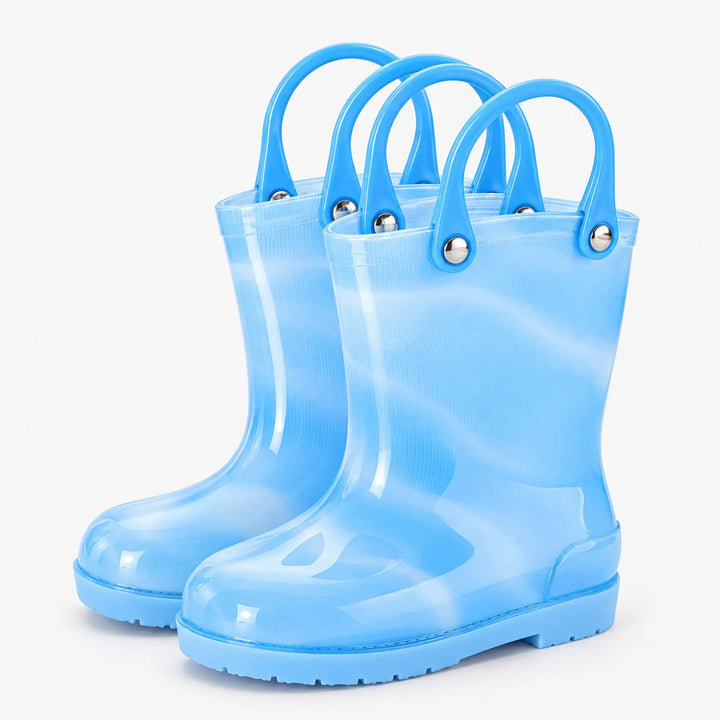 Pair of translucent light blue rain boots with blue carry handles attached by silver rivets on a white background. 5
