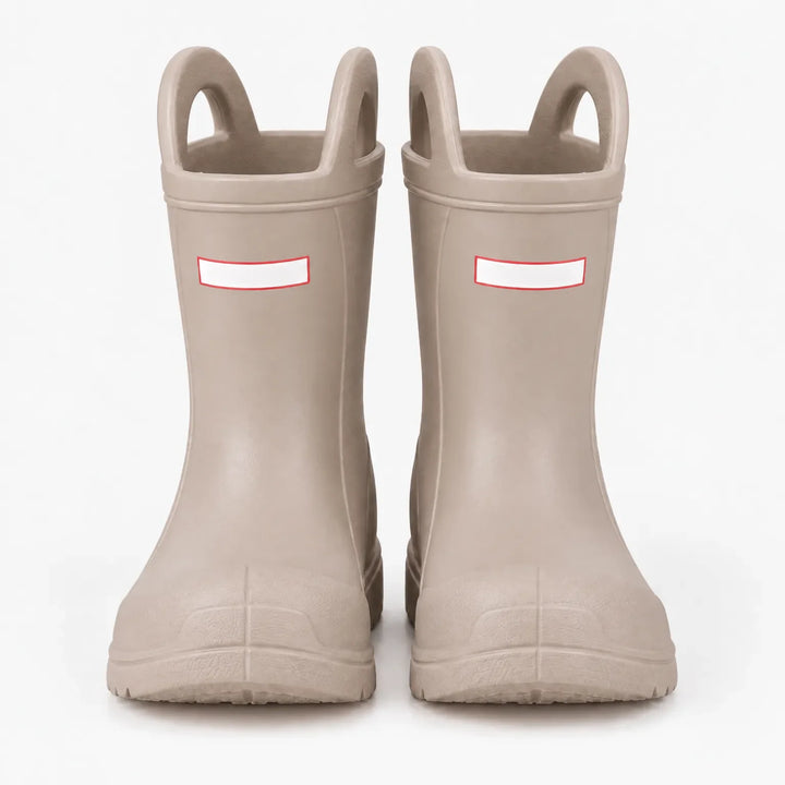 Front view of a pair of beige rain boots with top handles and a molded rubber toe cap. 7