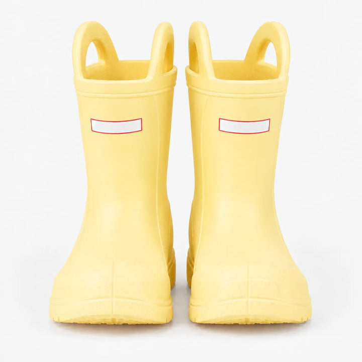 Front view of a pair of pale yellow rain boots with top handles on a white background. 9