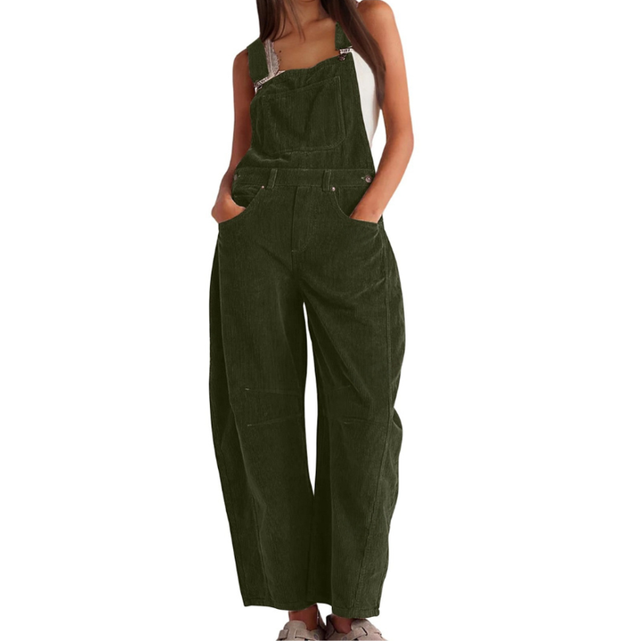 Olive green corduroy dungarees, front view, with hands in the pockets and a relaxed fit.