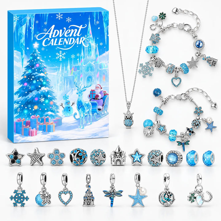Flat lay of the blue winter box with two charm bracelets, an owl necklace and loose charms 2