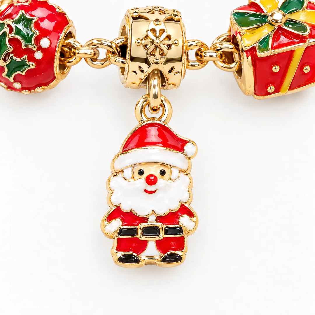 Close-up of a gold-tone enamel Santa charm hanging between a holly ornament bead and a red gift box bead. 3