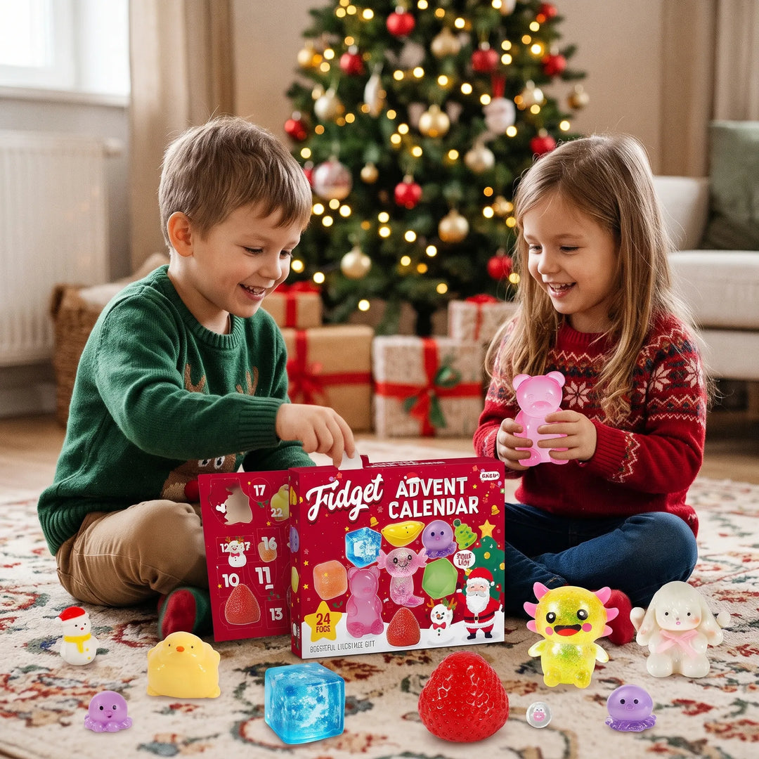 A boy and a girl in holiday sweaters play with squishy toys beside a red advent box 1