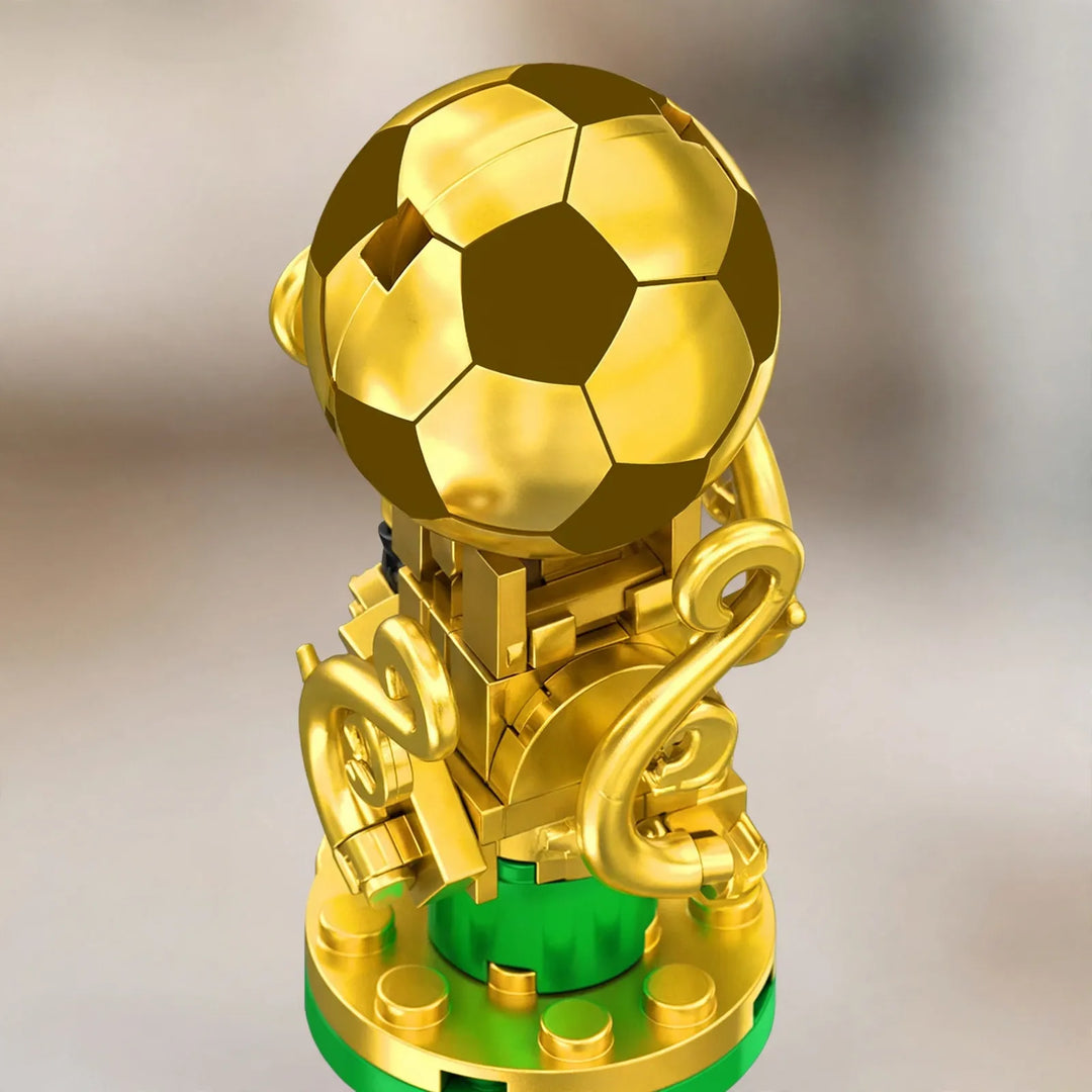 Close-up of the gold brick trophy topped with a soccer ball, on a round base 3