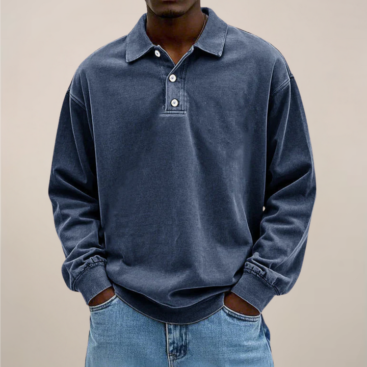 Men's relaxed-fit long sleeve polo in dark slate blue, front view.