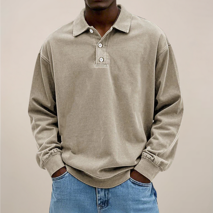 Men's relaxed-fit long sleeve polo in washed khaki beige, front view.