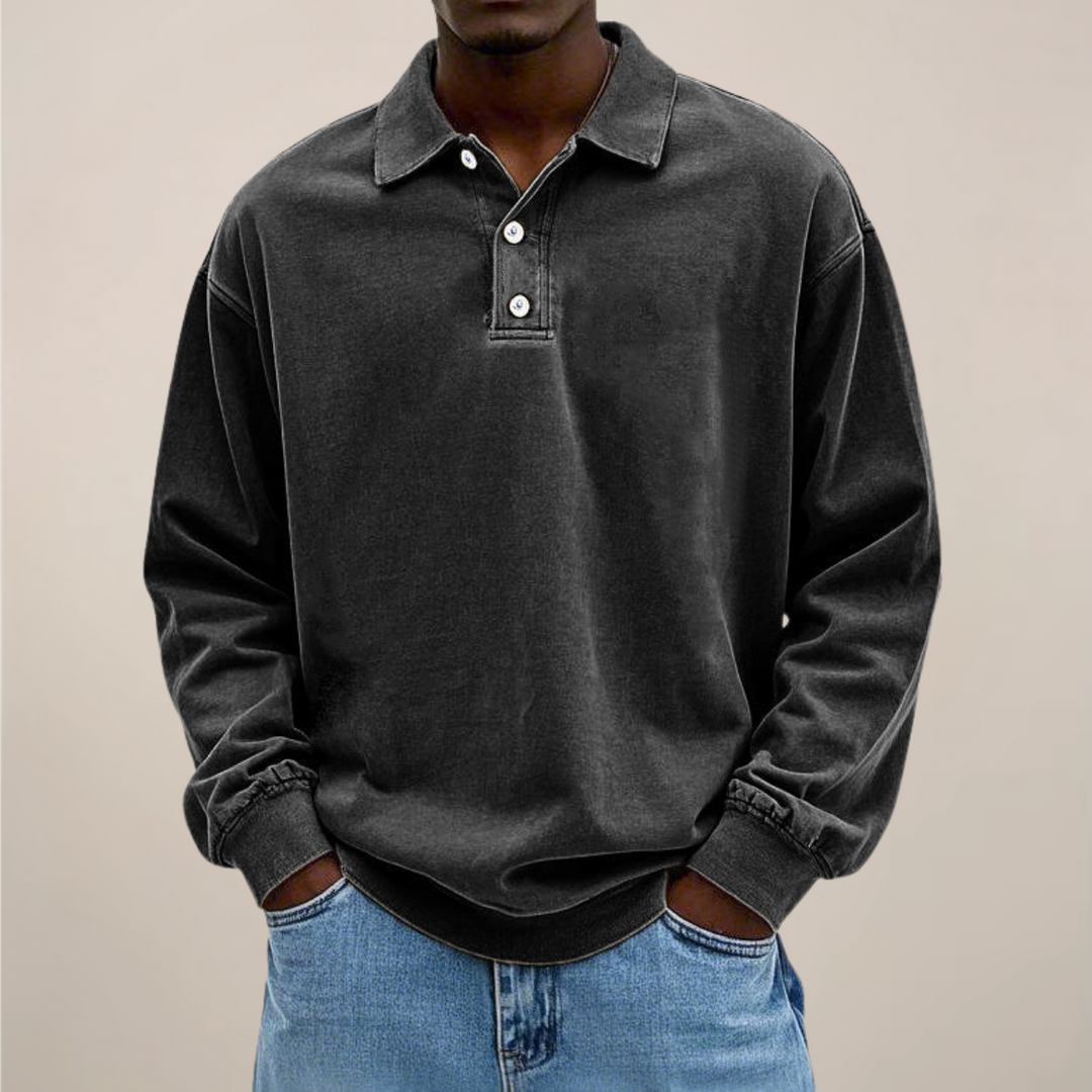 Men's relaxed-fit long sleeve polo in washed black, front view.