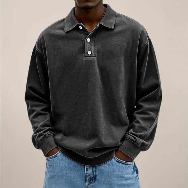 Men's relaxed-fit long sleeve polo in washed black, front view.