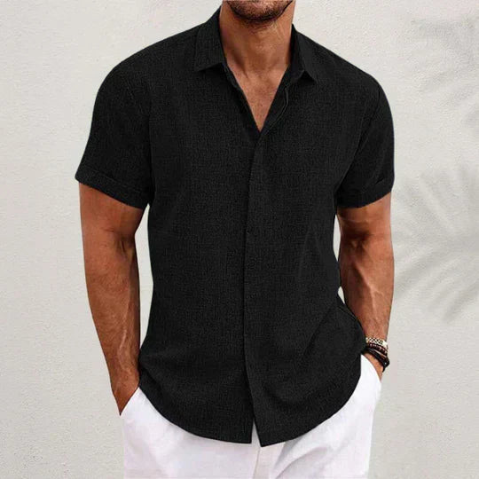 Men's short sleeve linen shirt in black, front view with a spread collar and button-up front.