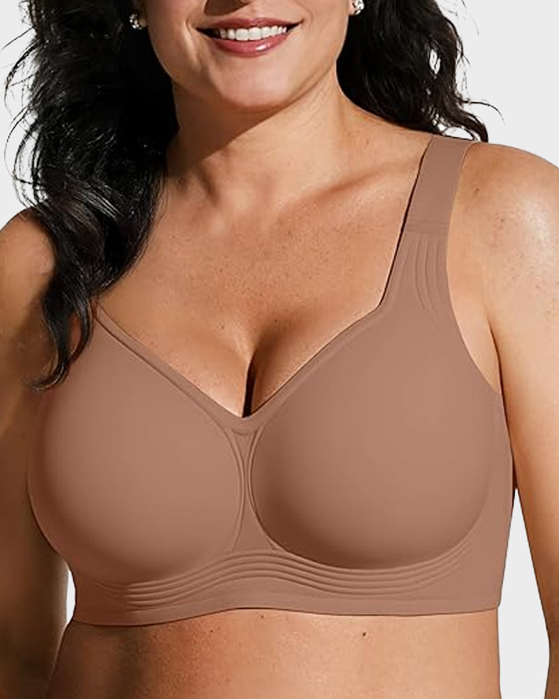 Smiling model wearing the bra in solid mocha brown, angled view showing smooth cups and band ribbing. 11