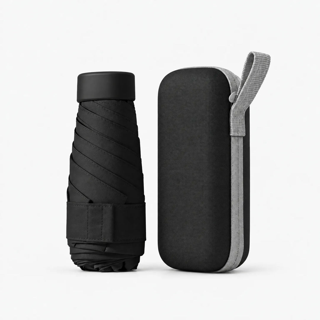 Folded black umbrella with cap and strap beside its matching black zippered hard case with a light gray carrying loop. 12
