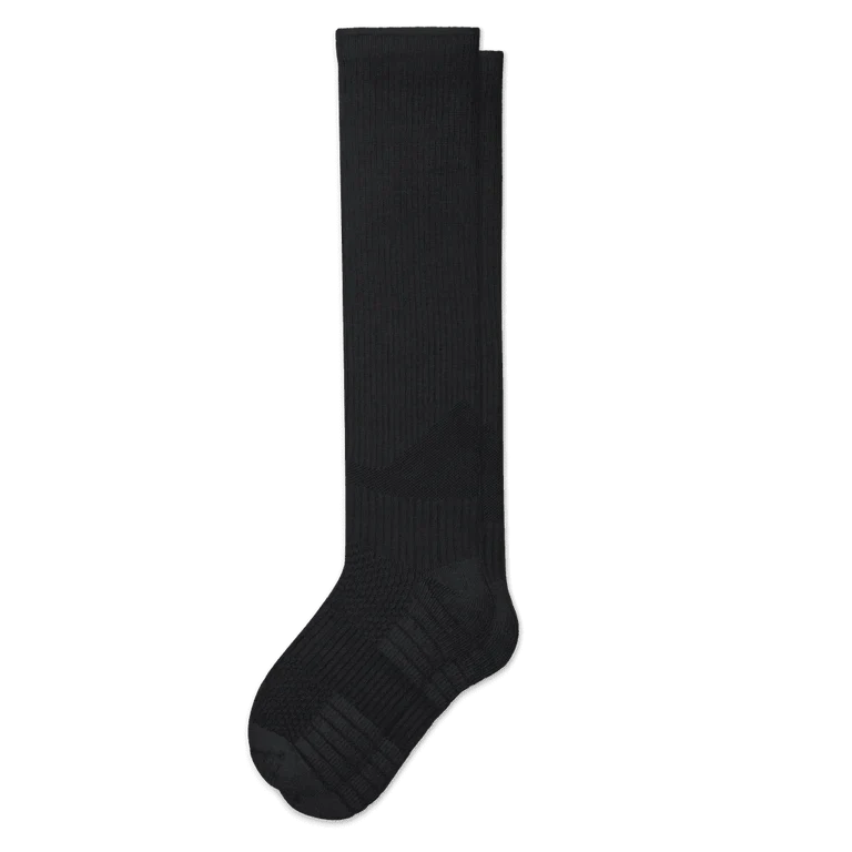 Pair of black knee-high ribbed socks laid flat on white, showing the cushioned heel and toe panels. 2