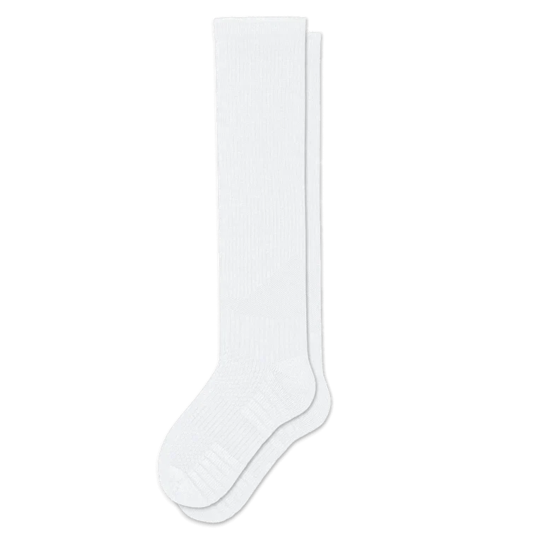 Pair of white knee-high ribbed socks laid flat, showing the textured heel and toe cushioning. 4