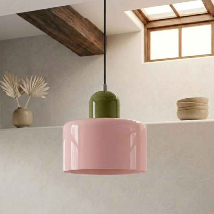 Pink drum pendant with an olive green rounded cap, hanging from a black cord beside a shelf with a vase and bowls. 2