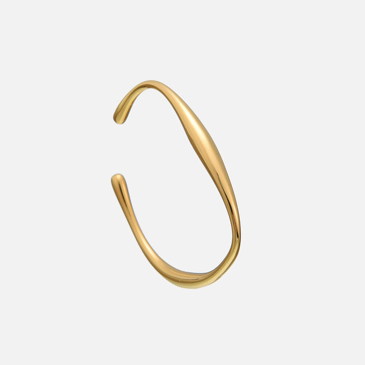 Lysa Gold Bracelet with a smooth gold cuff shape and rounded teardrop ends