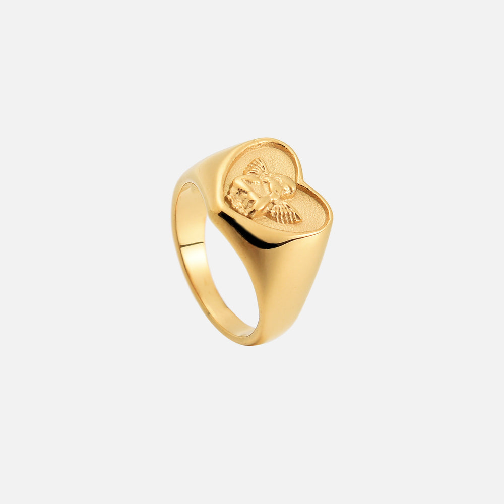 Same gold heart ring tilted to show the cherub relief and the smooth, polished band 2