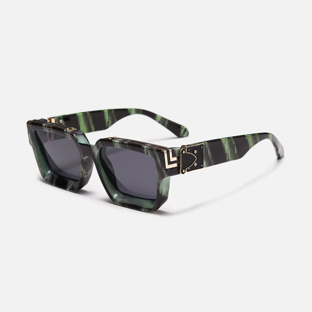 Green and black marbled frame with gold hinge detail and dark lenses, shown at an angle. 14