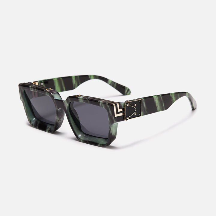 Green and black marbled frame with gold hinge detail and dark lenses, shown at an angle. 14