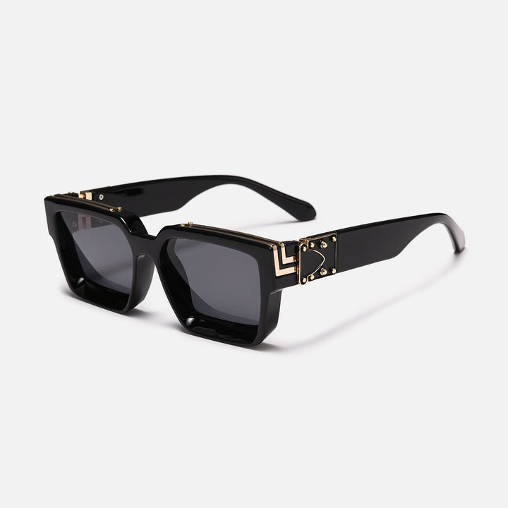 Glossy black square frame with gold hinge detail and dark gray lenses, shown at an angle. 8