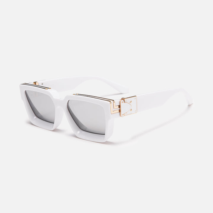 White square frame with gold hinge accents and mirrored silver lenses, shown at an angle. 17