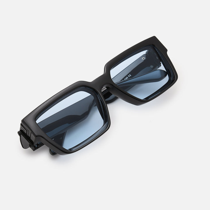 Folded black sunglasses with blue-tinted lenses, viewed from above at an angle. 6