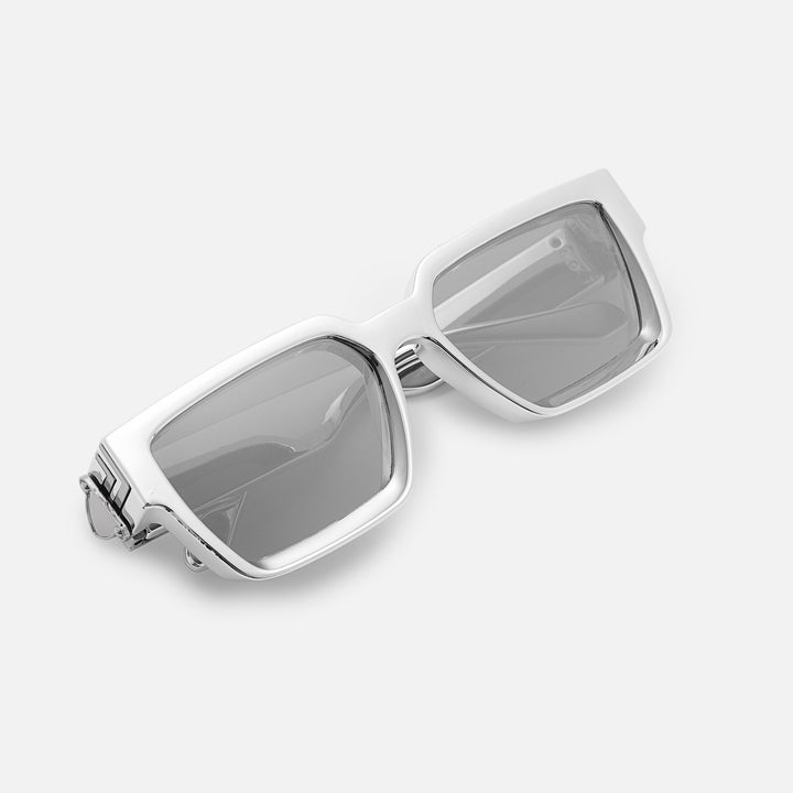 Folded silver chrome sunglasses with mirrored lenses, viewed from above at an angle. 13