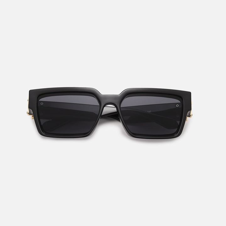 Black square sunglasses with gold hinge accents and dark lenses, folded flat and seen from the front. 9