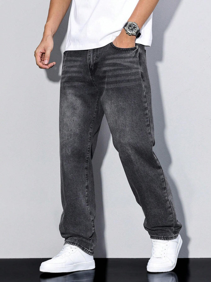 Model wearing dark charcoal gray washed jeans with white sneakers, hand tucked into the front pocket 6