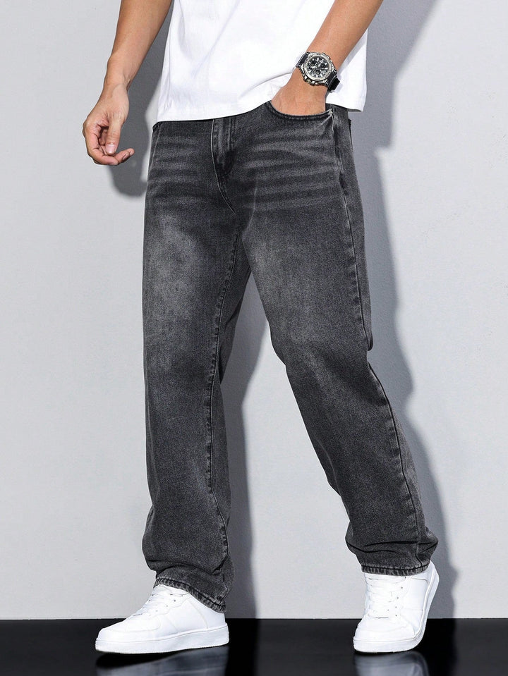 Charcoal gray jeans with light fading, worn by a model with a white tee and sneakers 10
