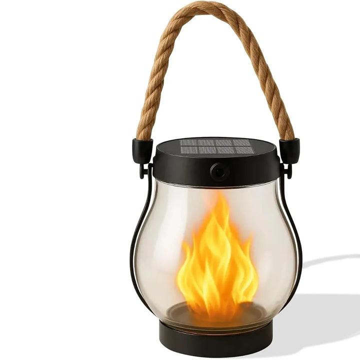 Front view of the lantern on a white background, showing the clear glass, black frame and flame glow 9