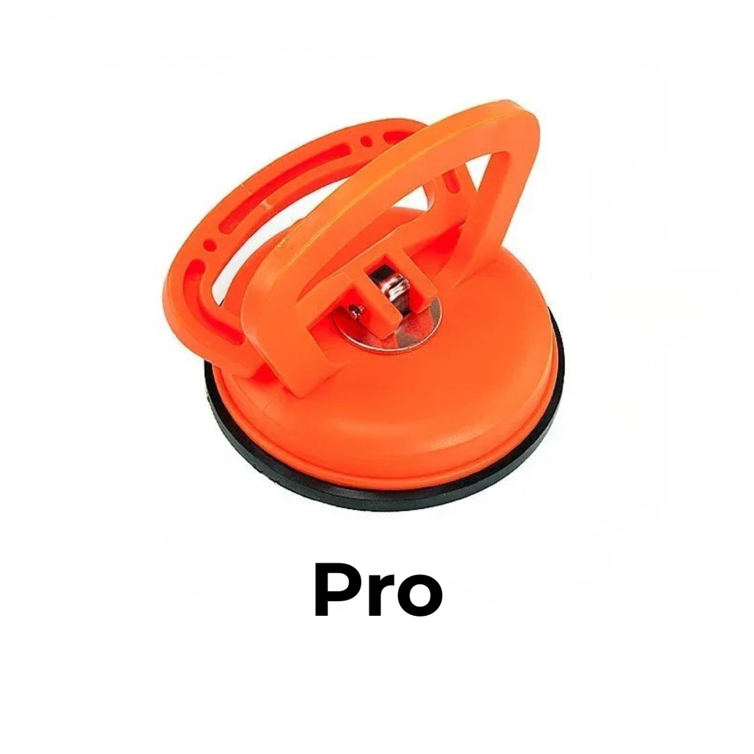 Larger orange suction cup dent puller with a metal center fitting, tall handle and black rubber seal on a white background.