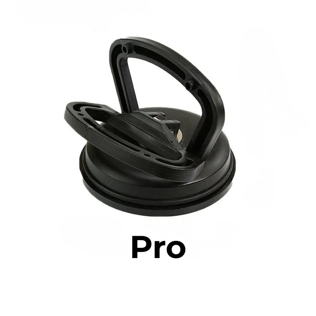 Larger black suction cup dent puller with a raised handle and black rubber base on a white background.