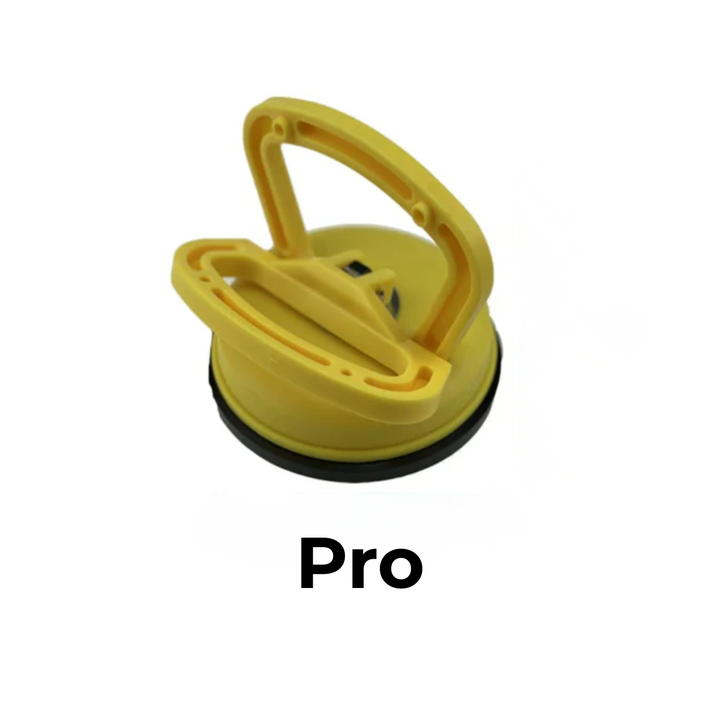 Larger yellow suction cup dent puller with a raised handle and black rubber seal on a white background.