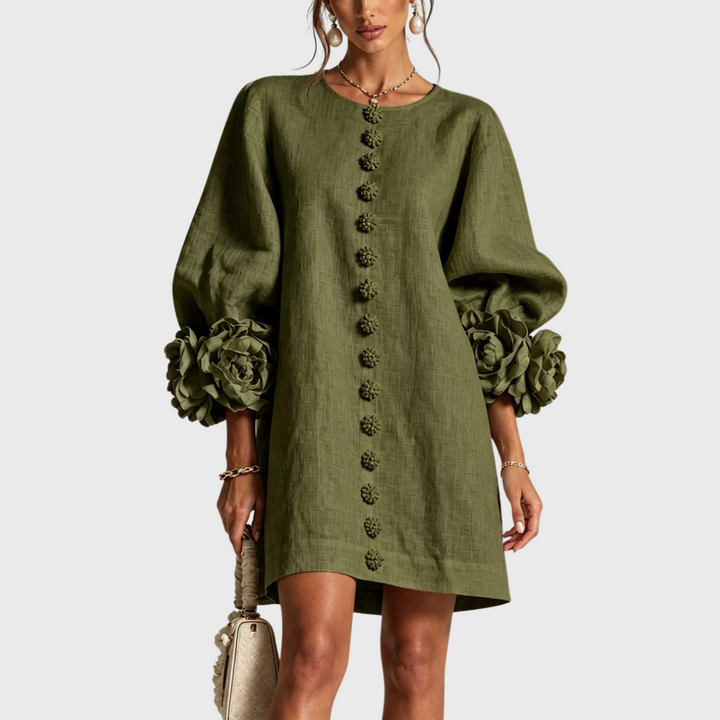 Olive green linen mini dress with puff sleeves and flower buttons, front view.