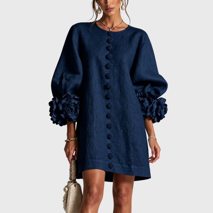 Navy blue linen mini dress with puff sleeves and flower buttons, front view.