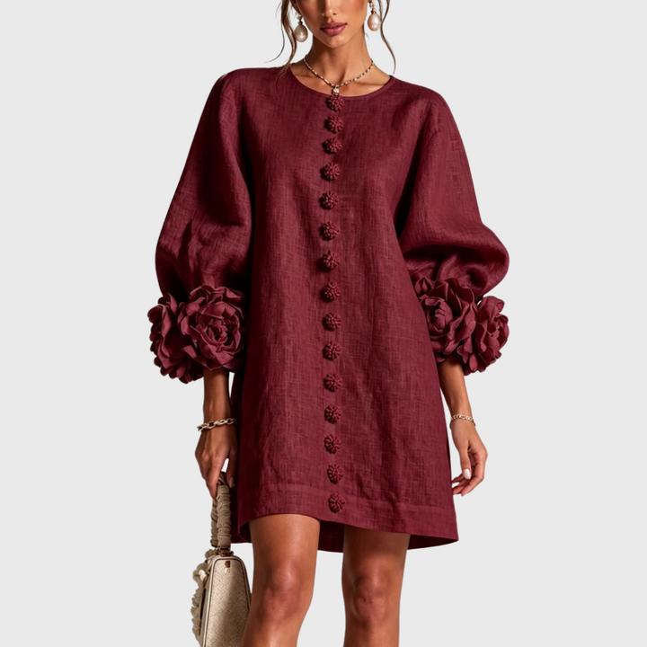 Deep burgundy linen mini dress with puff sleeves and flower buttons, front view.