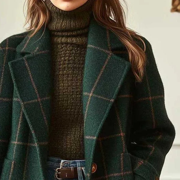 Close-up of the wide notch lapels and tan check pattern on the green coat 3