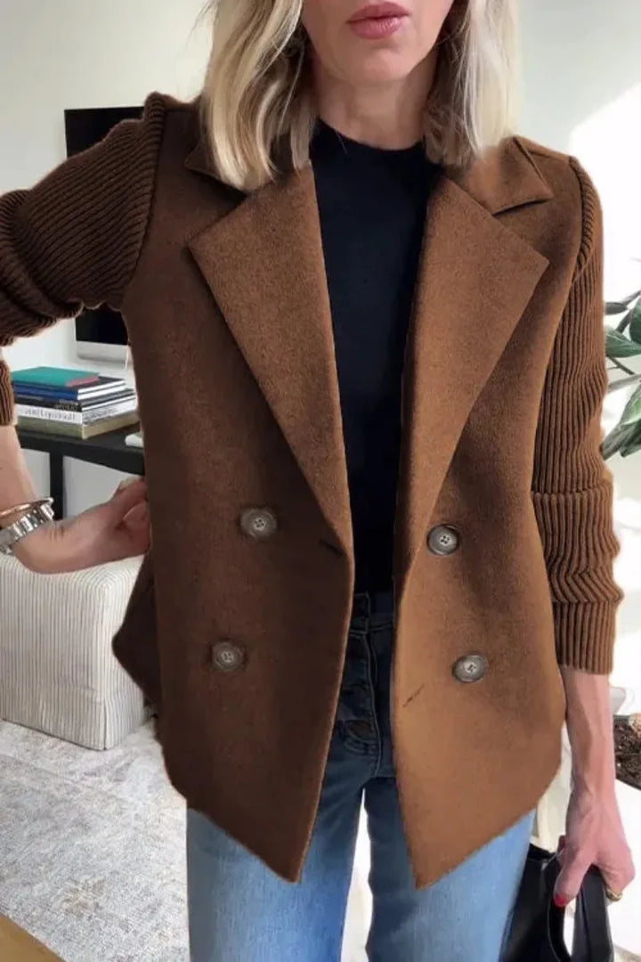 Close-up of the brown jacket on a model, showing four buttons, lapels and ribbed knit sleeves 15