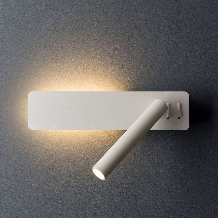 Black rectangular wall light with a swiveling spot tube angled downward and two small switches.