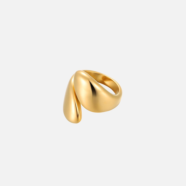 Polished gold-tone open ring with two smooth, rounded teardrop-shaped ends, shown at an angle on a plain light gray background. 1