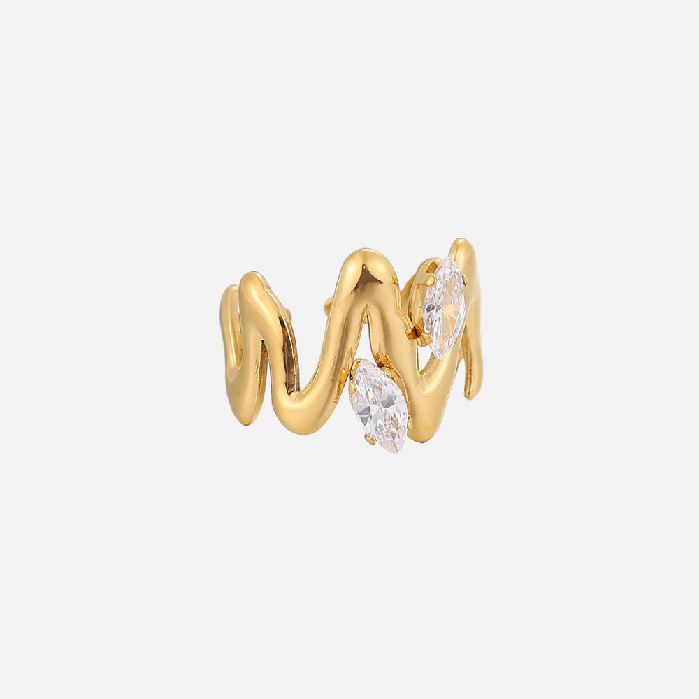 Side detail of the wavy gold-tone ring with two clear marquise-cut stones in prong settings.
