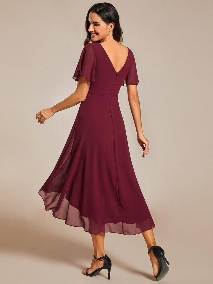 Back view of the burgundy chiffon dress with deep V back, zipper and layered high-low hem. 4