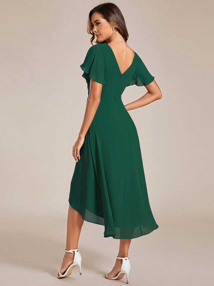 Back view of the dark green dress with deep V back, zipper and sweeping high-low chiffon hem. 11