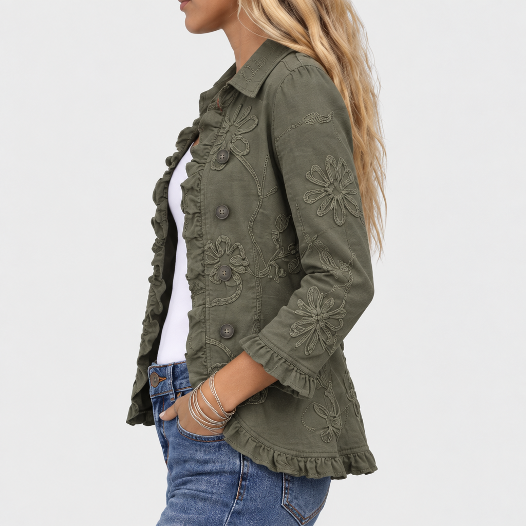 Detail of the olive green jacket sleeve with floral embroidery, ruffled cuff, and open front buttons.
