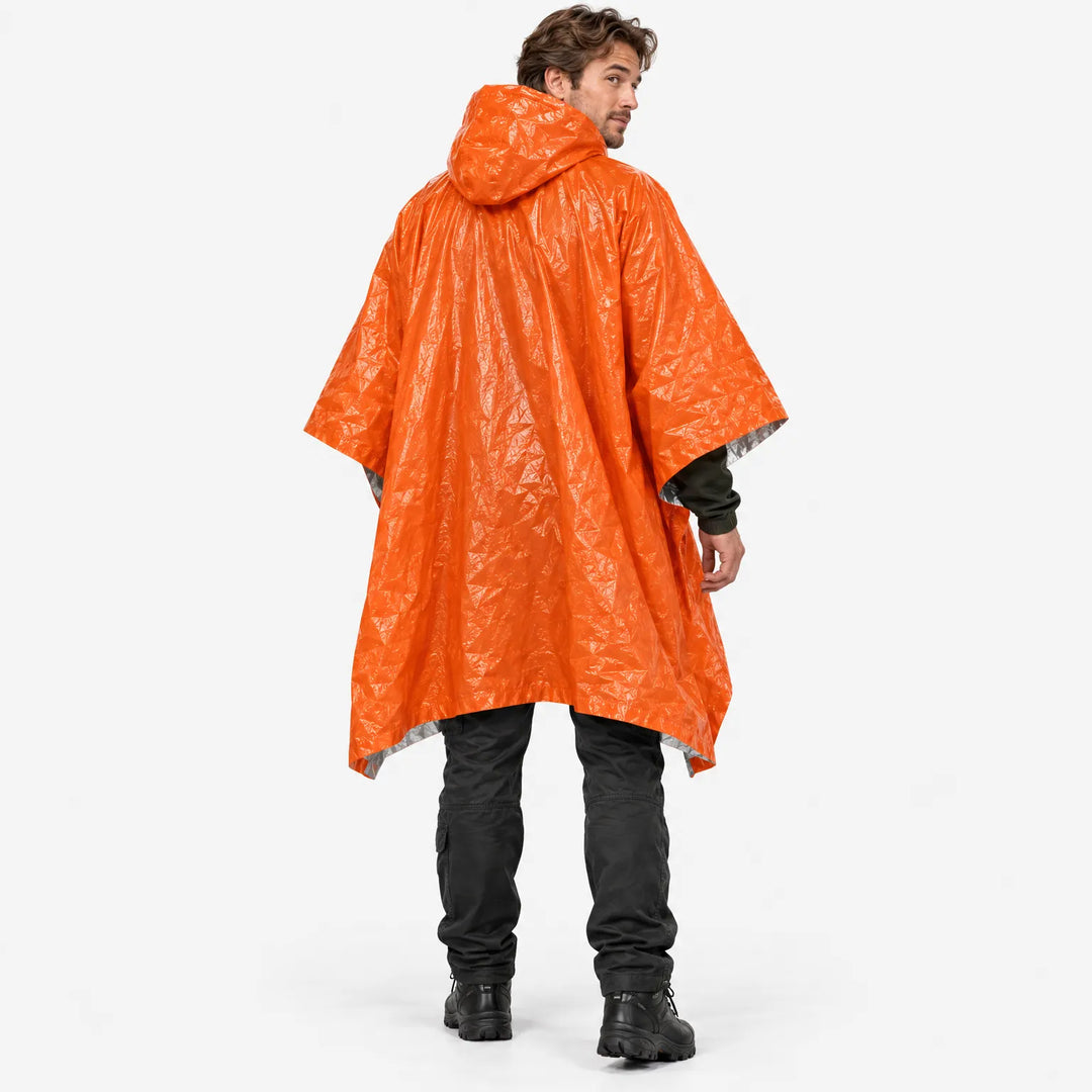 Back view of a man in the orange hooded poncho, looking over his shoulder, with black pants and boots. 4