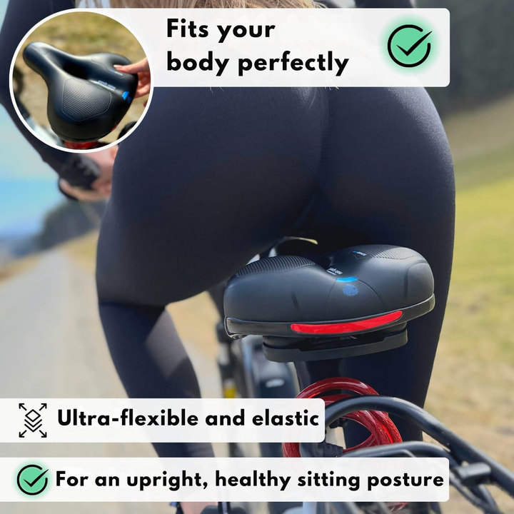 Another view of the black saddle, showing the rear with a red reflective strip.
