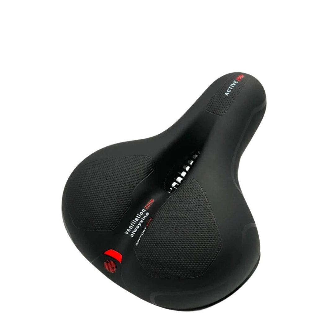 Black bike saddle with textured support pads, a central ventilation cutout and red accents on the rear.