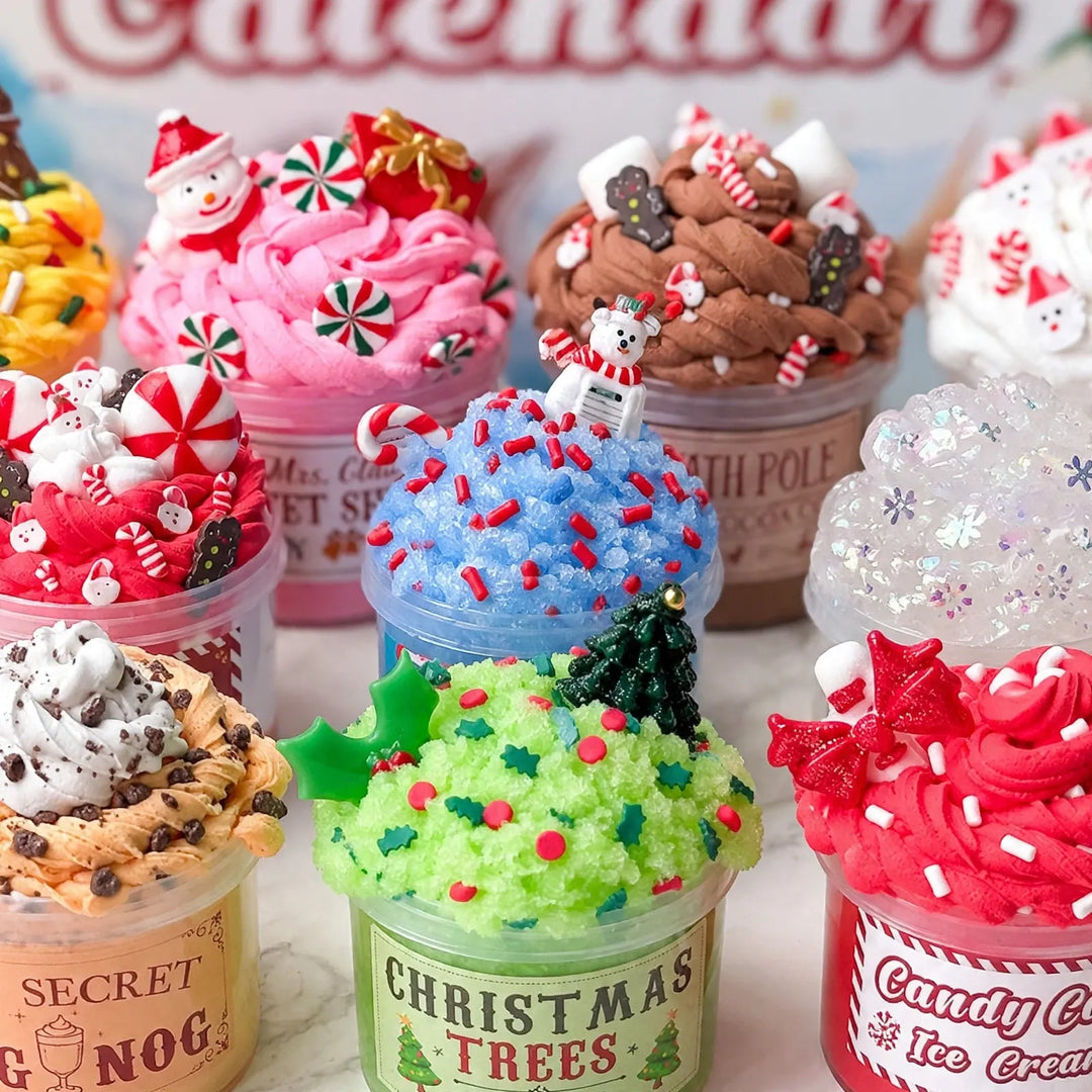 Close-up of slime pots decorated like desserts, with snowman, candy and tree charms on top 3